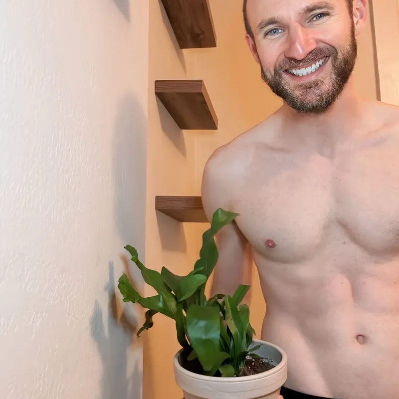 Repotting a plant, smiling